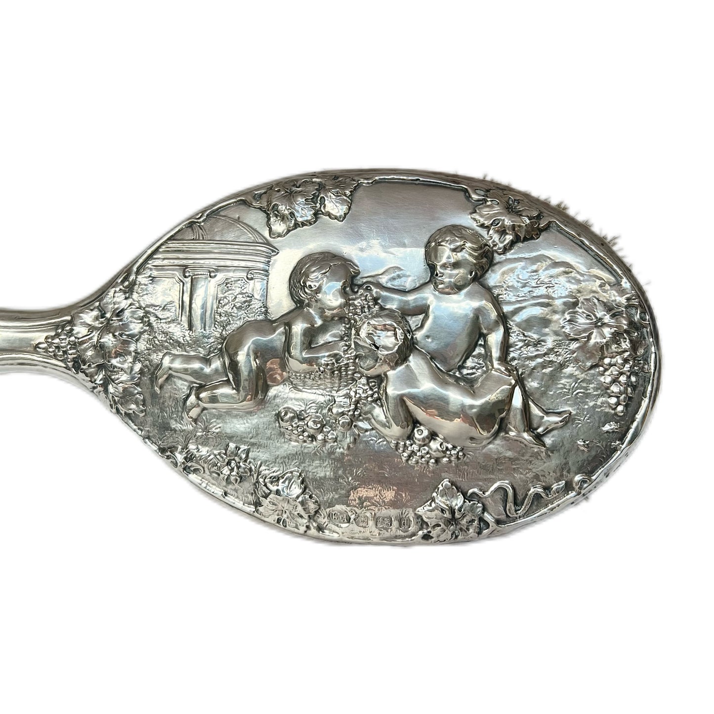Beautiful antique English sterling silver hair brush with motifs of putti and grapes, William Aitken