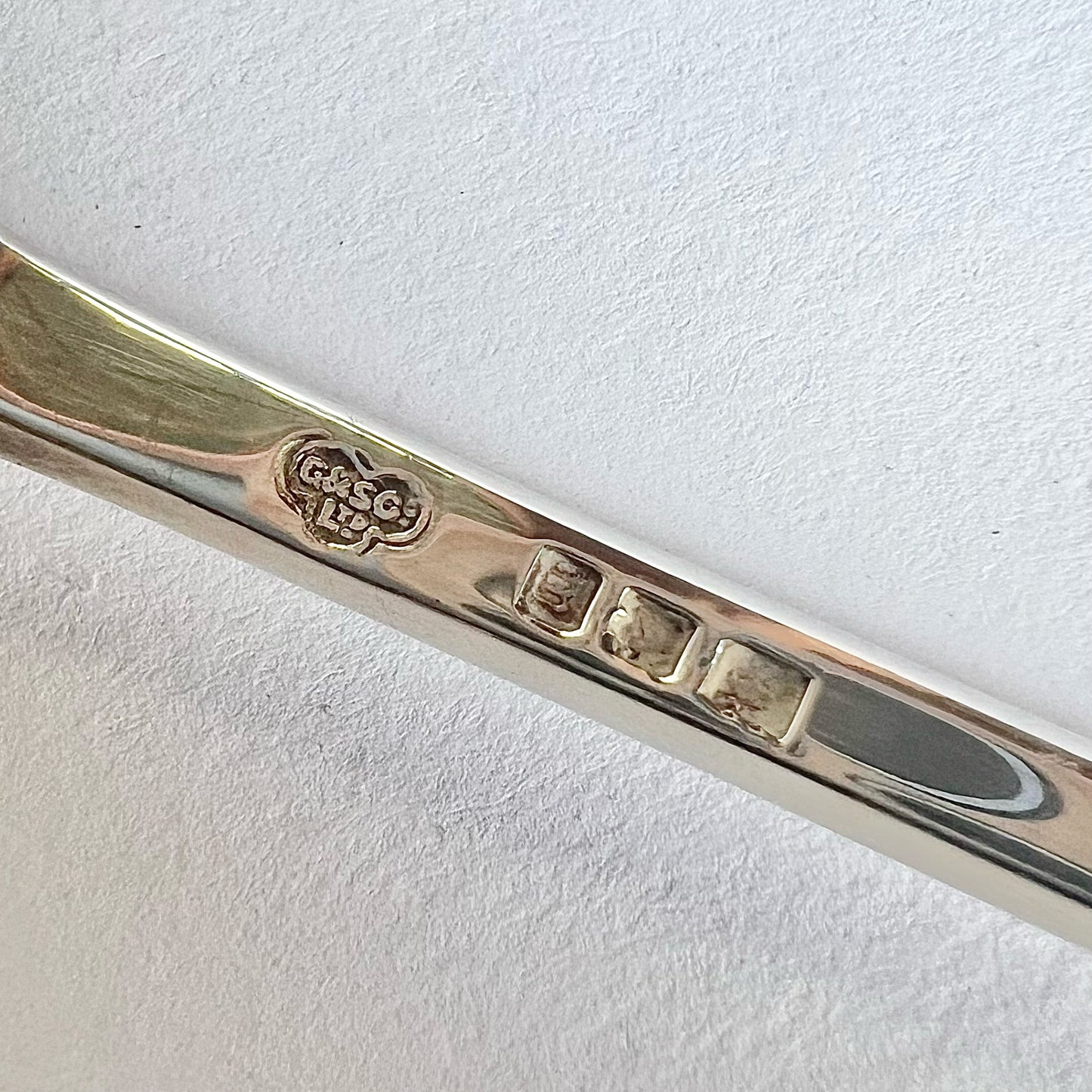 Pair of George V sterling silver serving spoons in original case