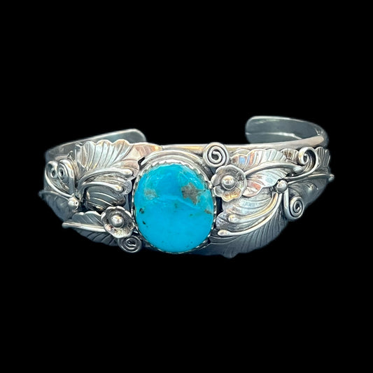 Brazalete vintage Navajo de plata de ley y plumas turquesas