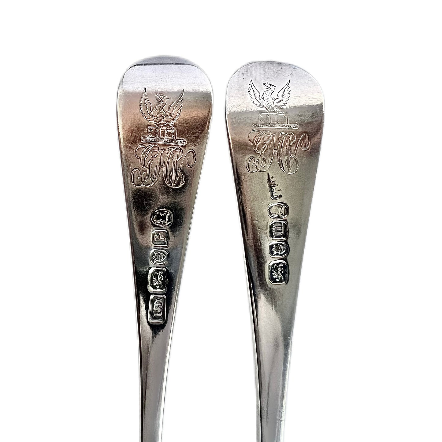 Pair of antique George III Hanoverian pattern crested sterling silver tableforks