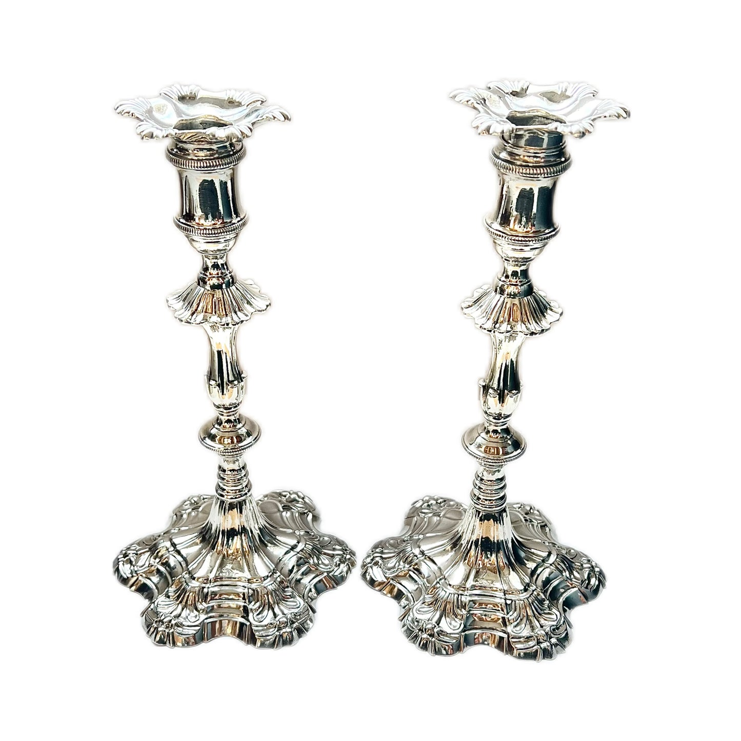 Pair of crested George III sterling silver cast candlesticks by William Cafe, London 1761 and 1762
