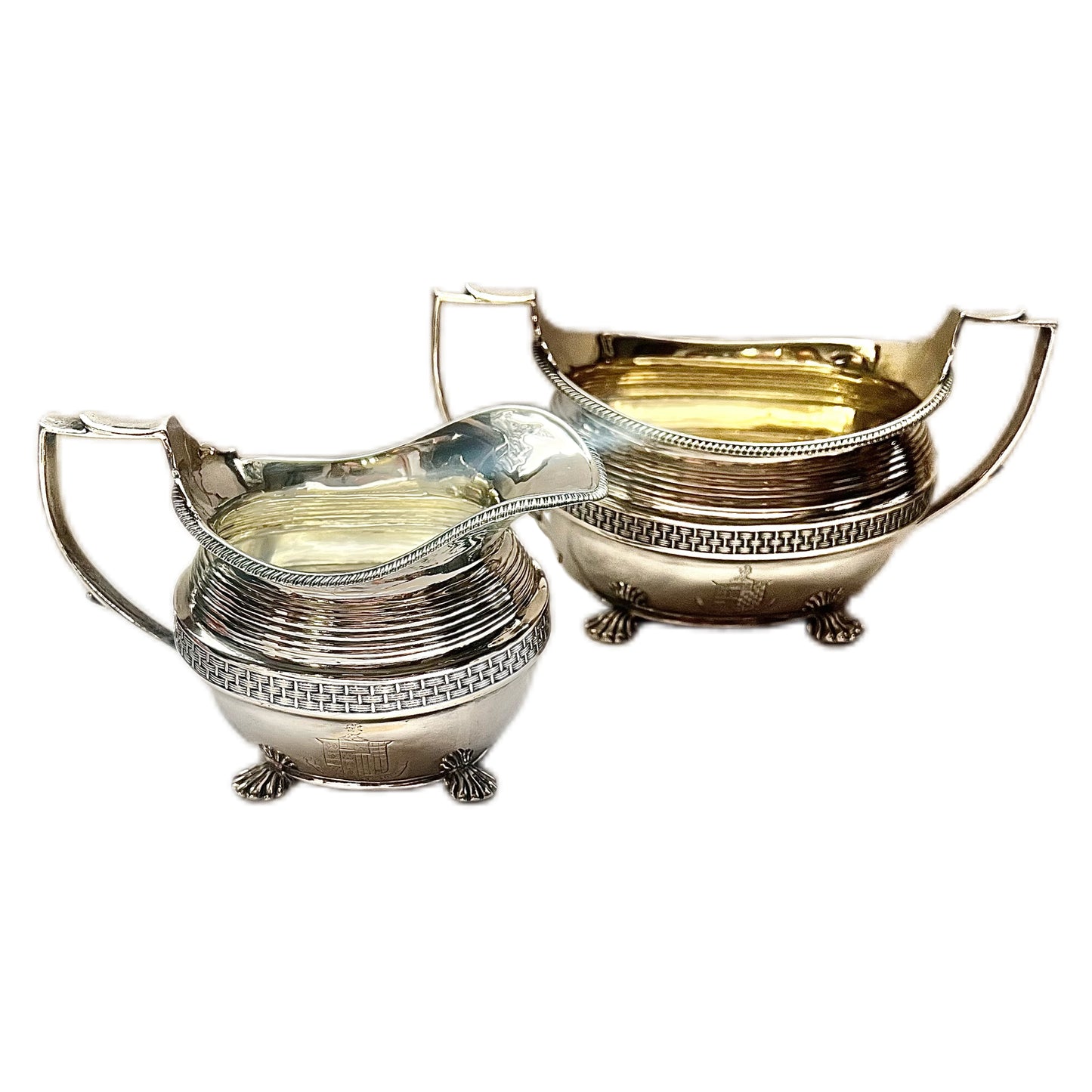 Crested George III sterling silver creamer jug and sugar bowl set