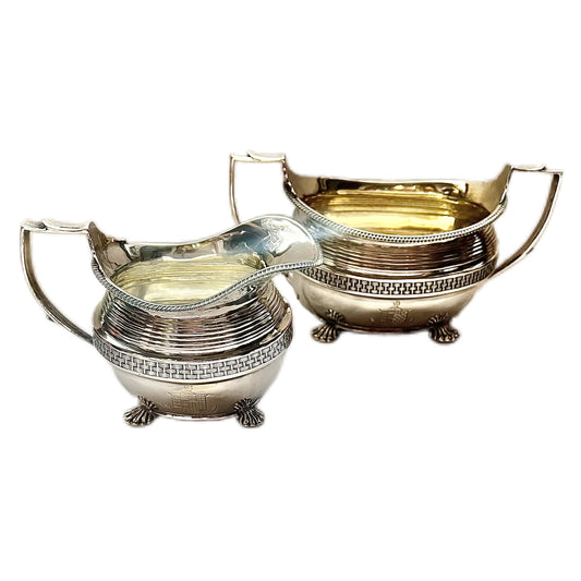 Crested George III sterling silver creamer jug and sugar bowl set