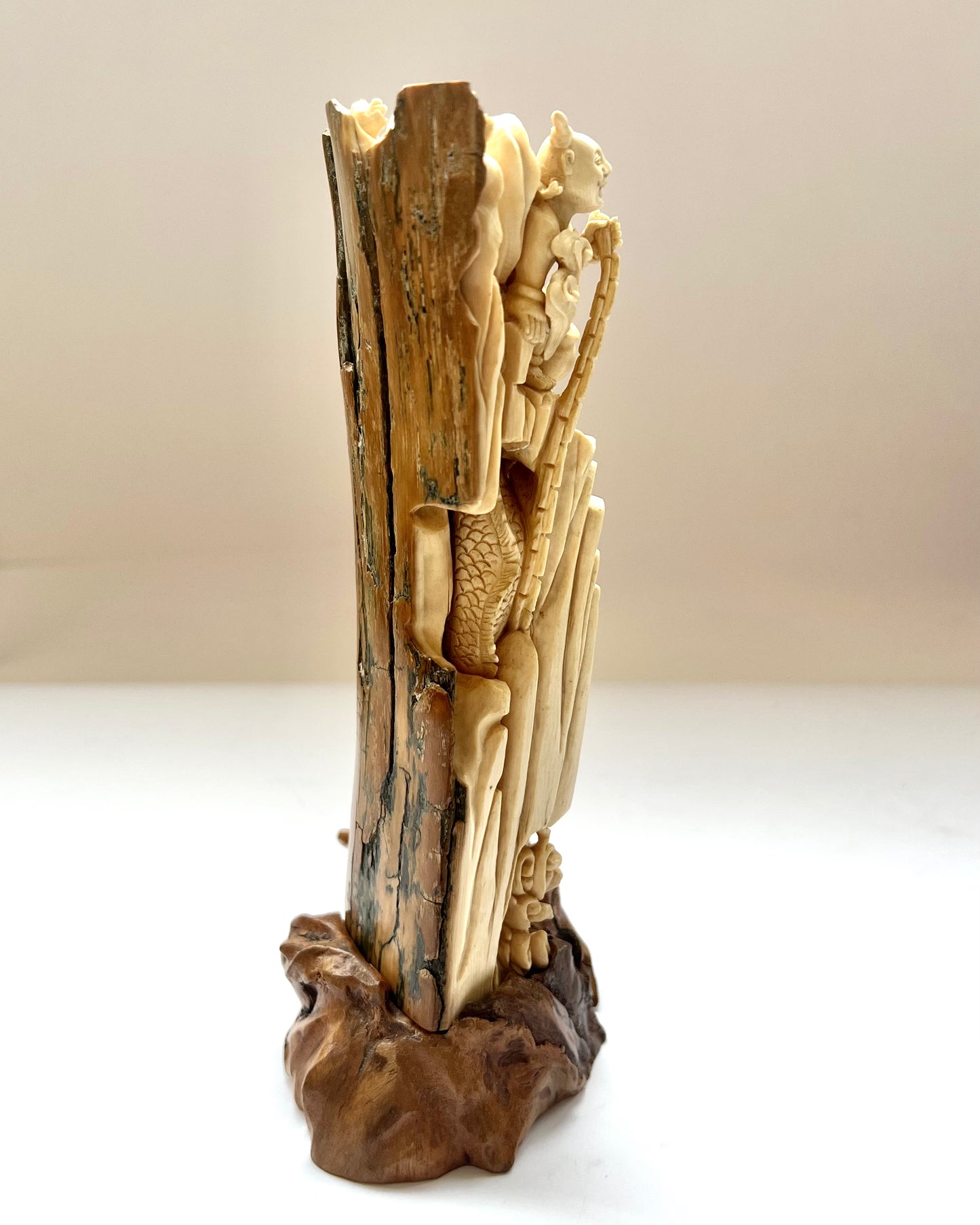 Early to mid 19th century Qing dynasty ivory carving of Nezha subduing Ao Guang, the Dragon King of the East Sea