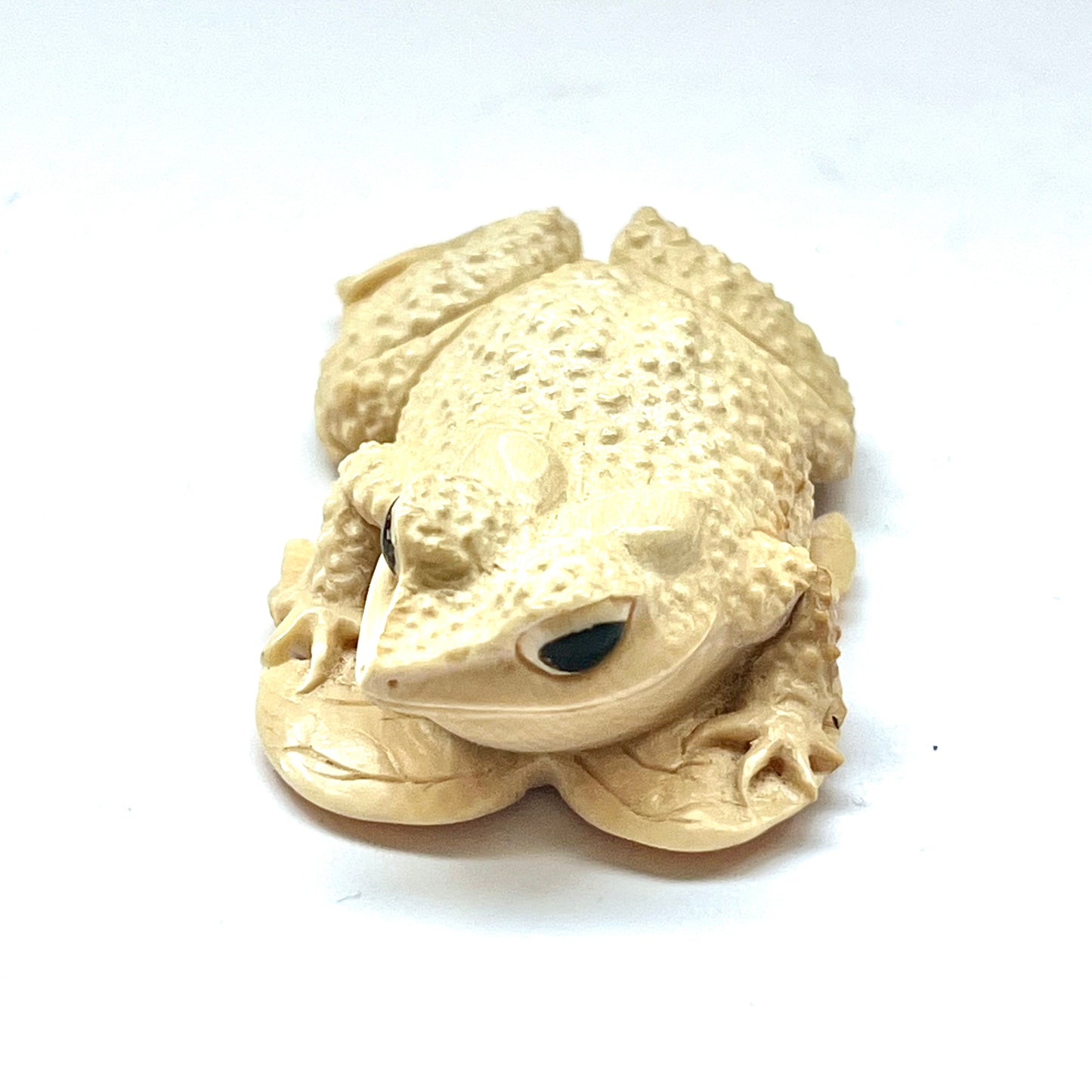 Antique Japanese ivory okimono depicting a toad upon a leaf circa mid-Meiji Period