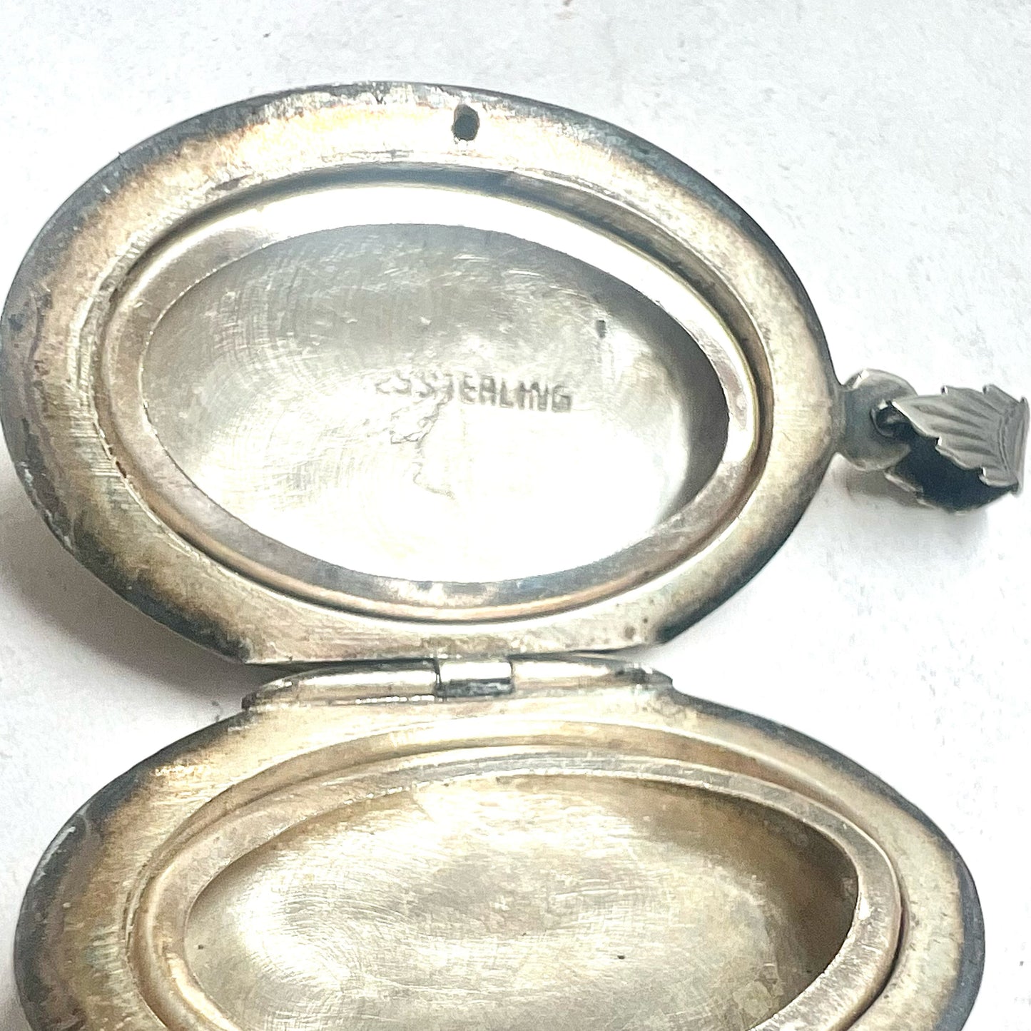 Vintage sterling silver locket with engraved designs