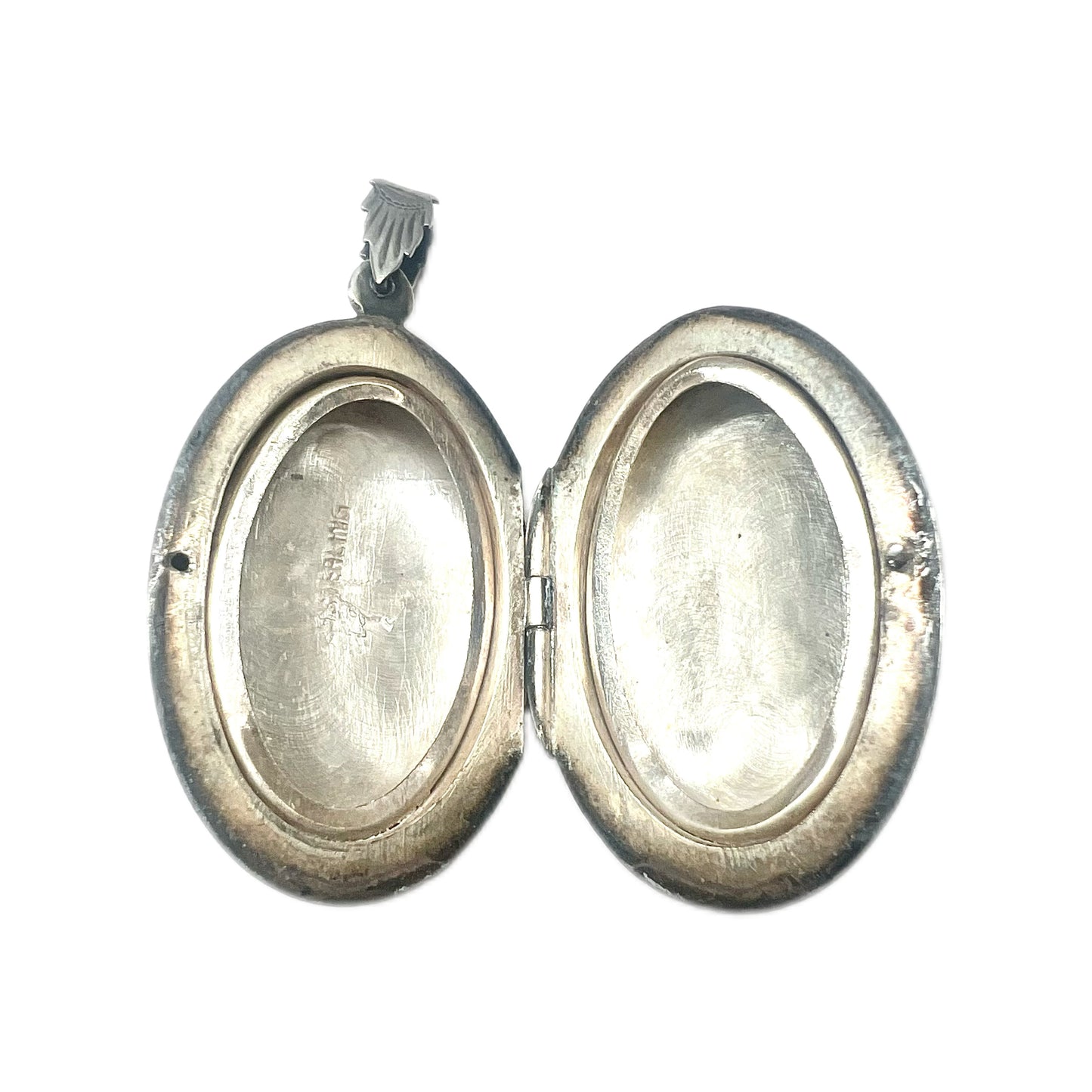 Vintage sterling silver locket with engraved designs