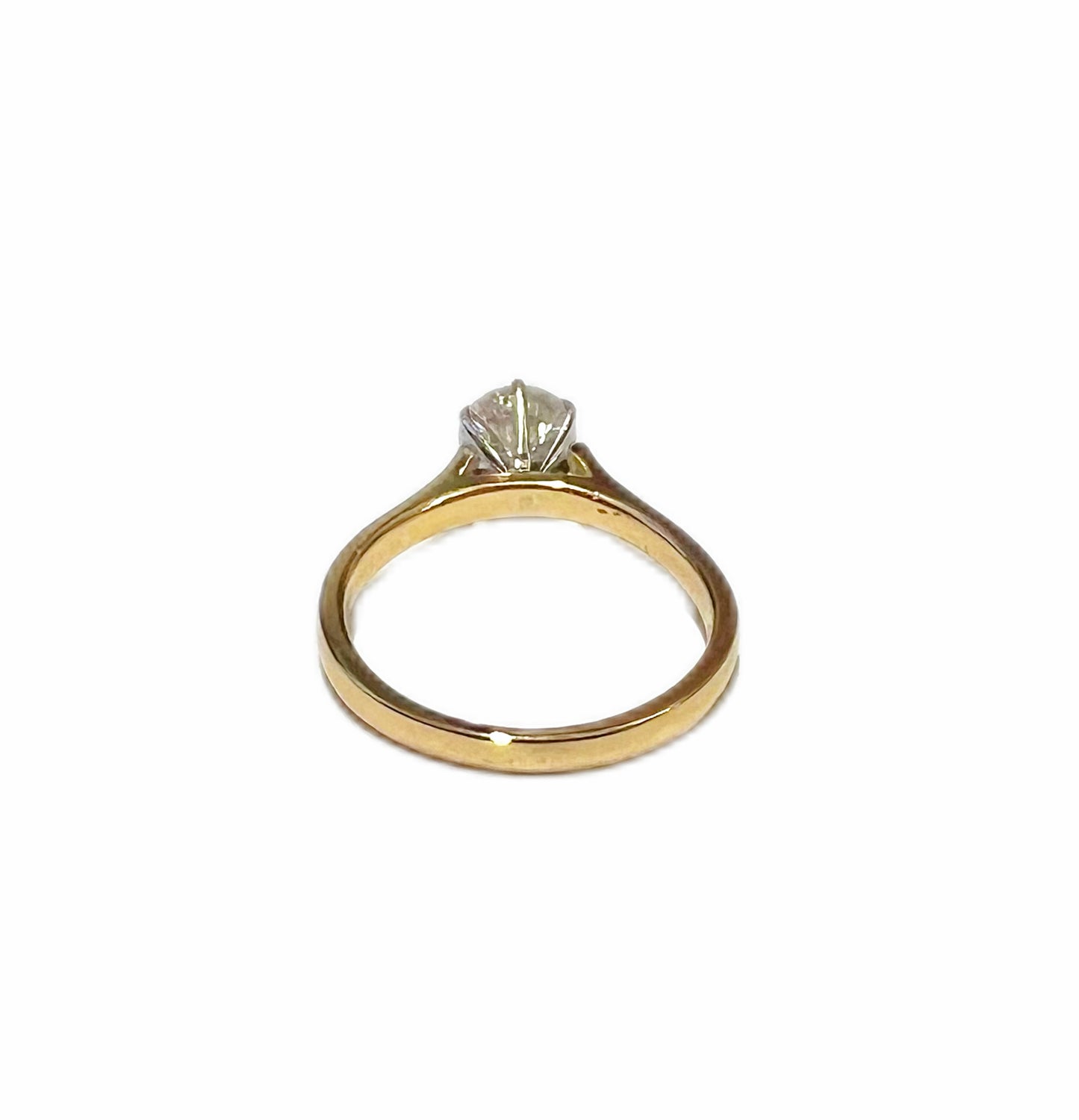 14 carat gold and round brilliant cut .08 carat diamond solitaire ring