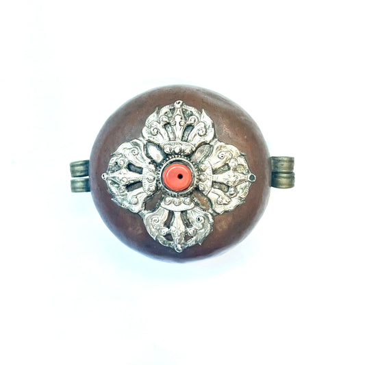Tibetan Buddhist brass and copper ghau amulet box with silver and coral inlay, circa early to mid 20th century