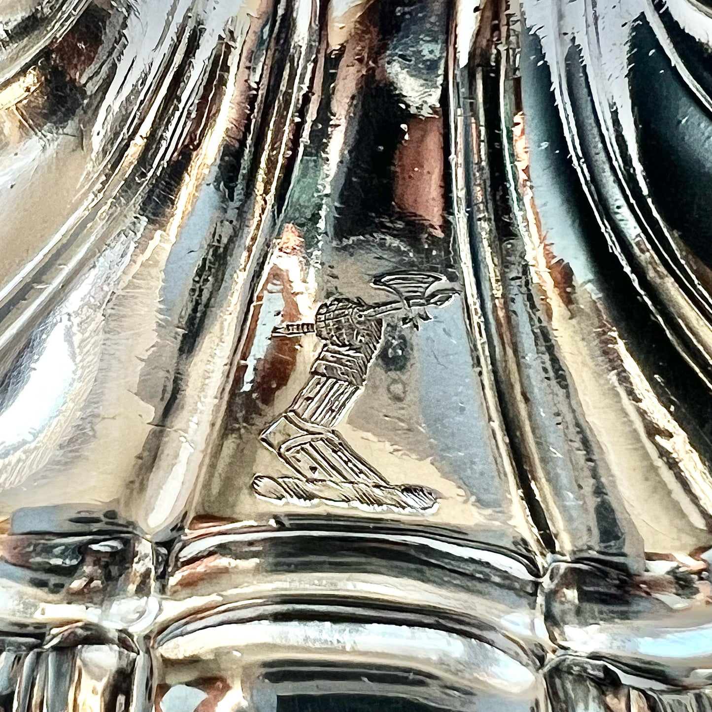 Pair of crested George III sterling silver cast candlesticks by William Cafe, London 1761 and 1762