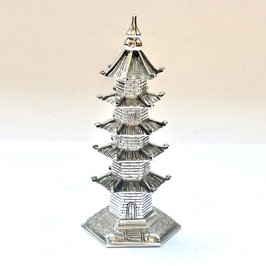 Early 20th century pagoda novelty form pepperette, marks for .900 silver and Wang Hing