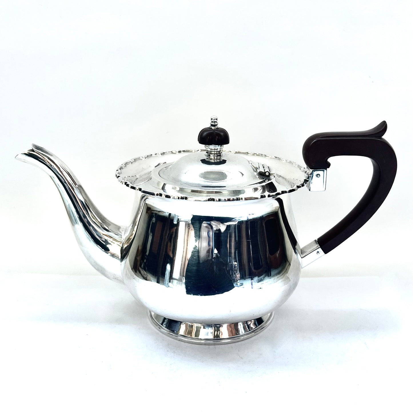 1930s Australian W.J. Sanders sterling silver teapot with Art Deco finial and handles, likely bakelite