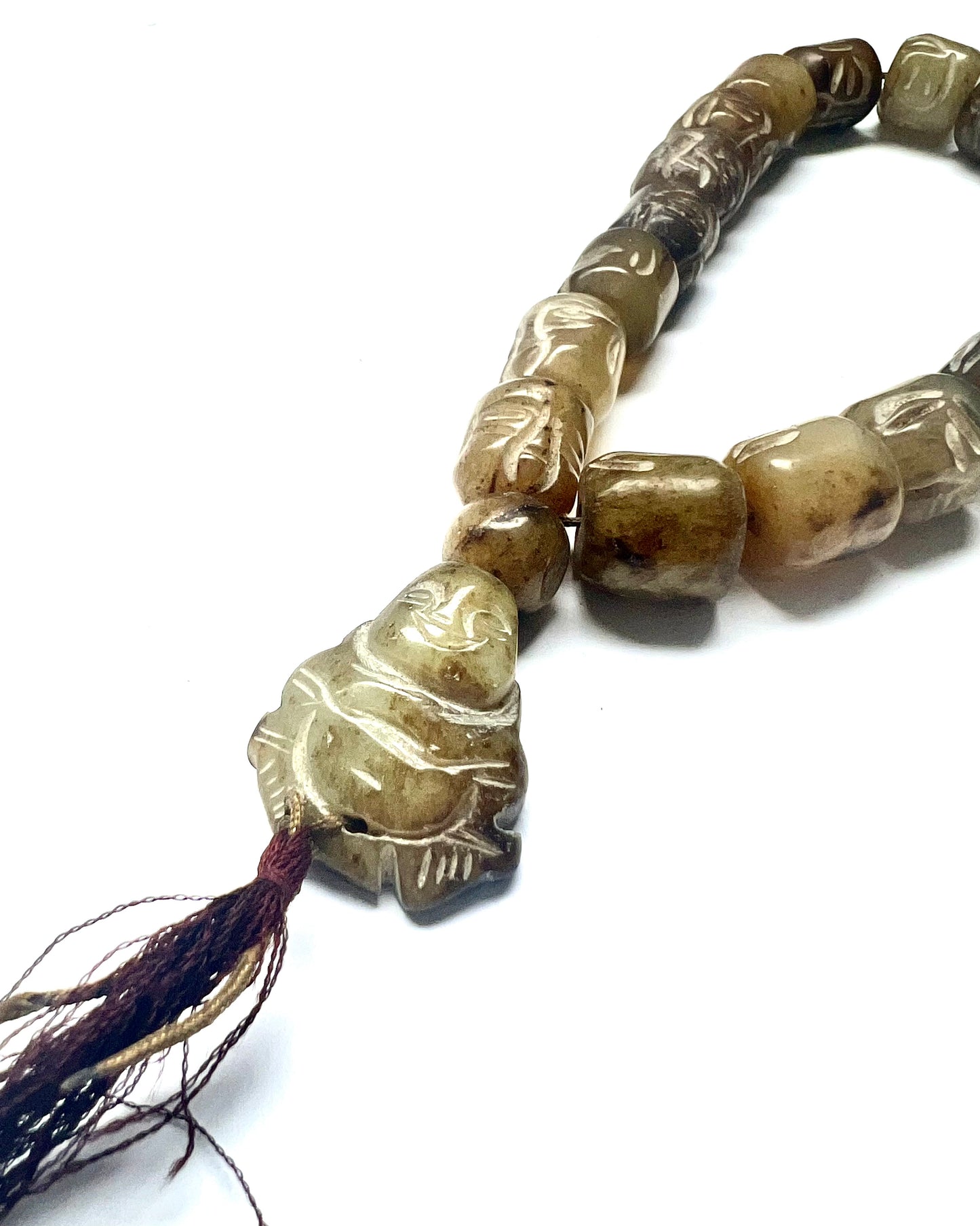 Vintage 20th century strand of green hardstone worry beads, face beads and Buddha plaque.