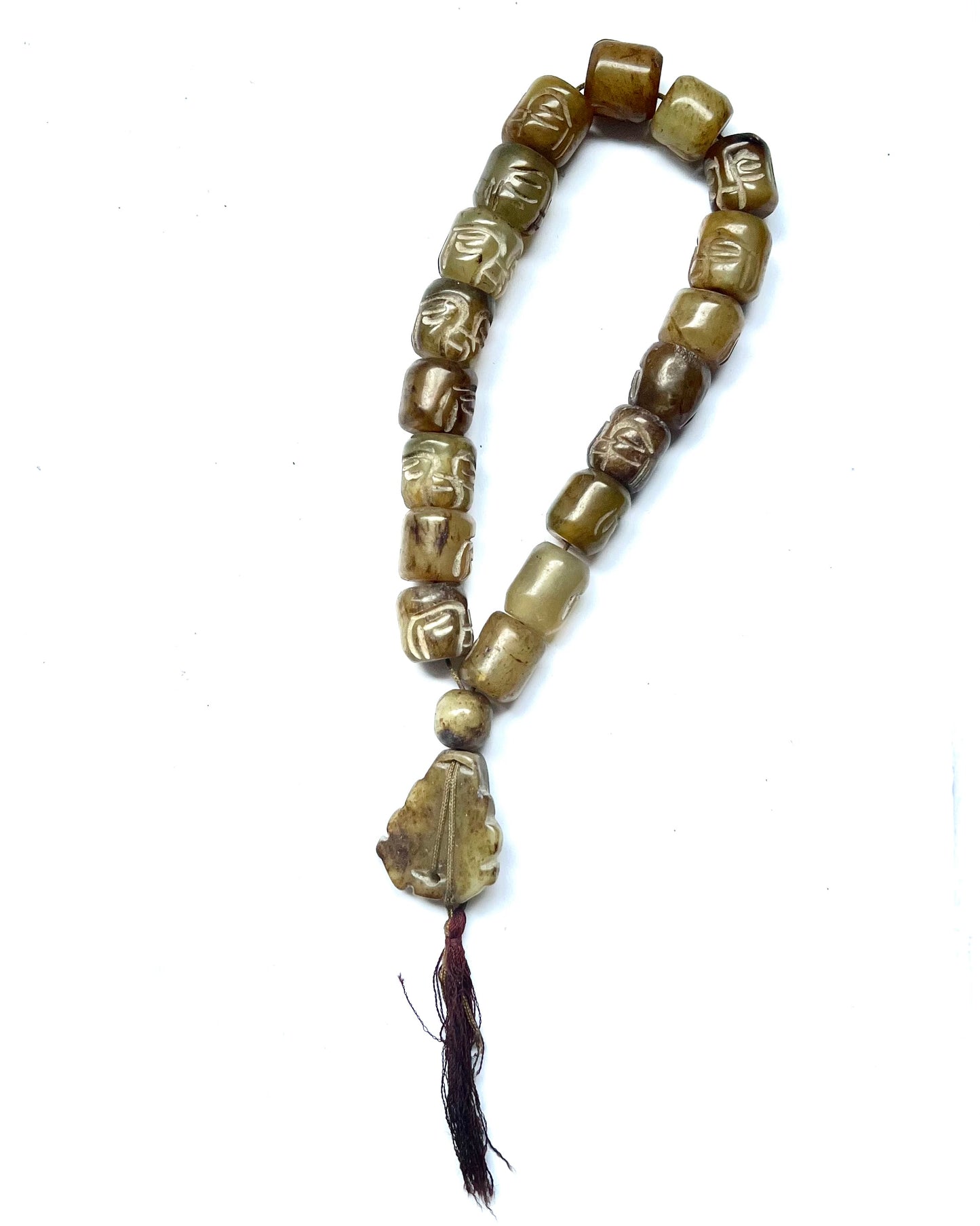 Vintage 20th century strand of green hardstone worry beads, face beads and Buddha plaque.