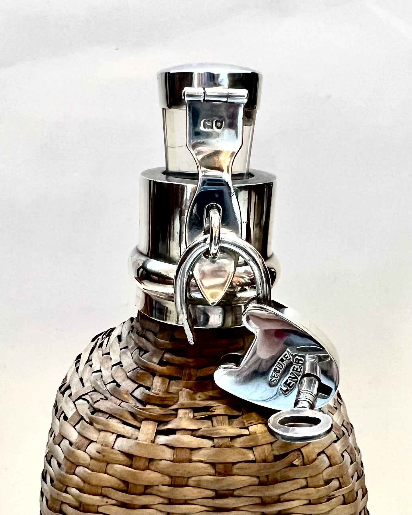 Edwardian wicker and sterling silver bottle, London 1903, Hukin & Heath