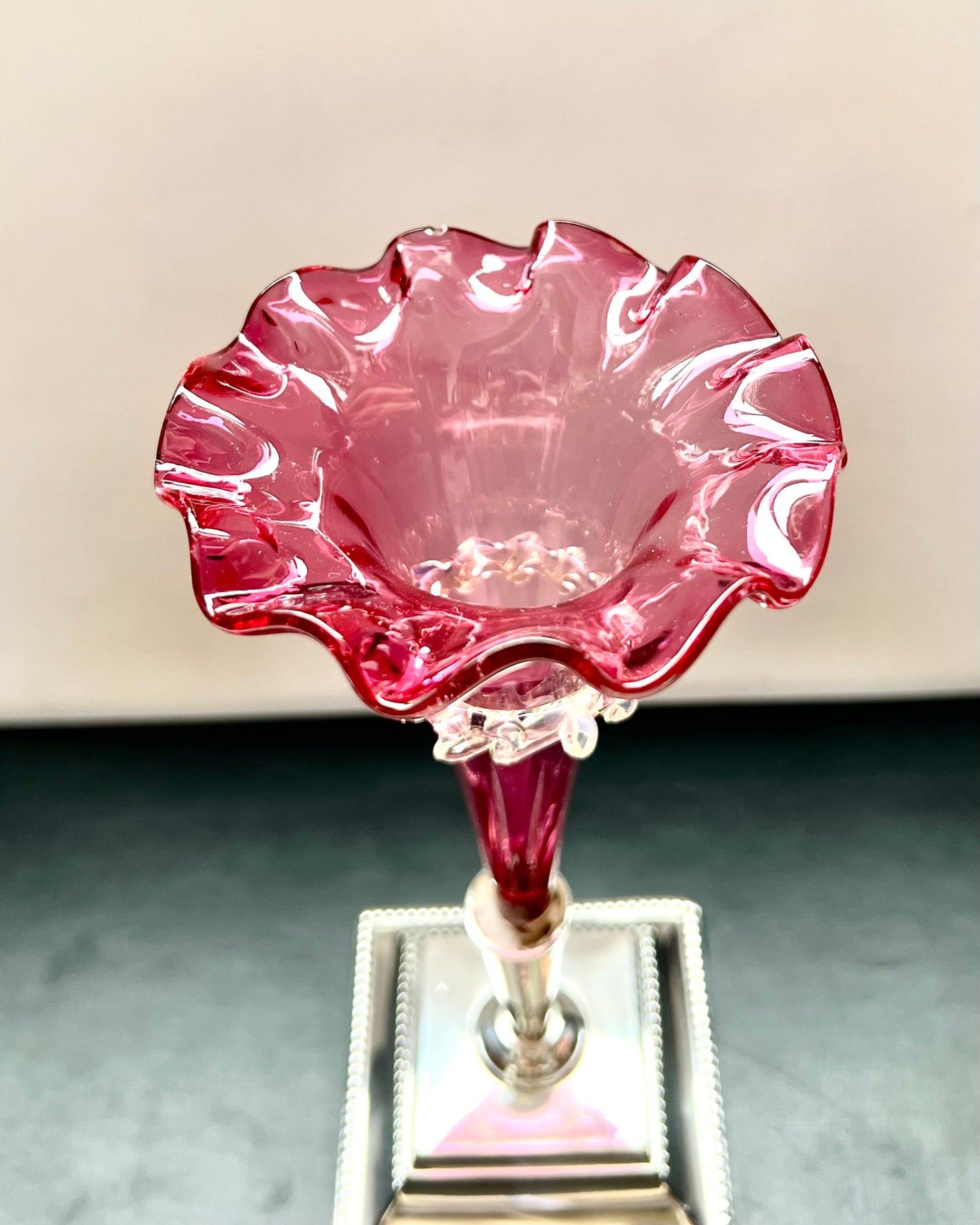 Pair of antique Edwardian cranberry glass epergnes with sterling silver bases