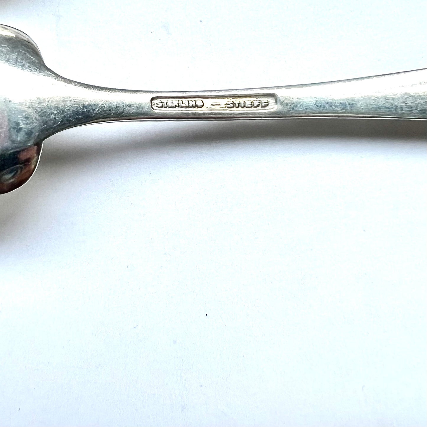 Vintage 1930s American sterling silver Rose Pattern ice cream spoons by Stieff of Baltimore, Maryland.