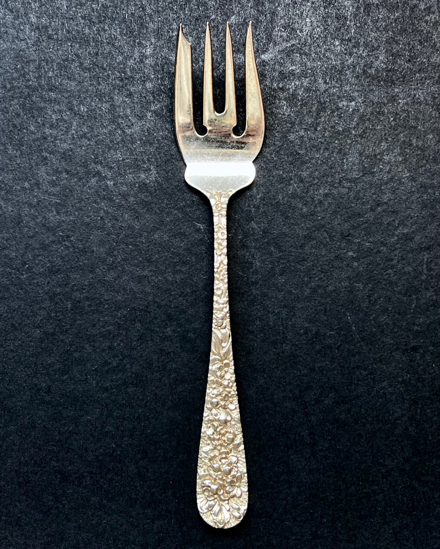 Vintage 1930s American sterling silver Rose Pattern salad fork by Stieff of Baltimore, Maryland.