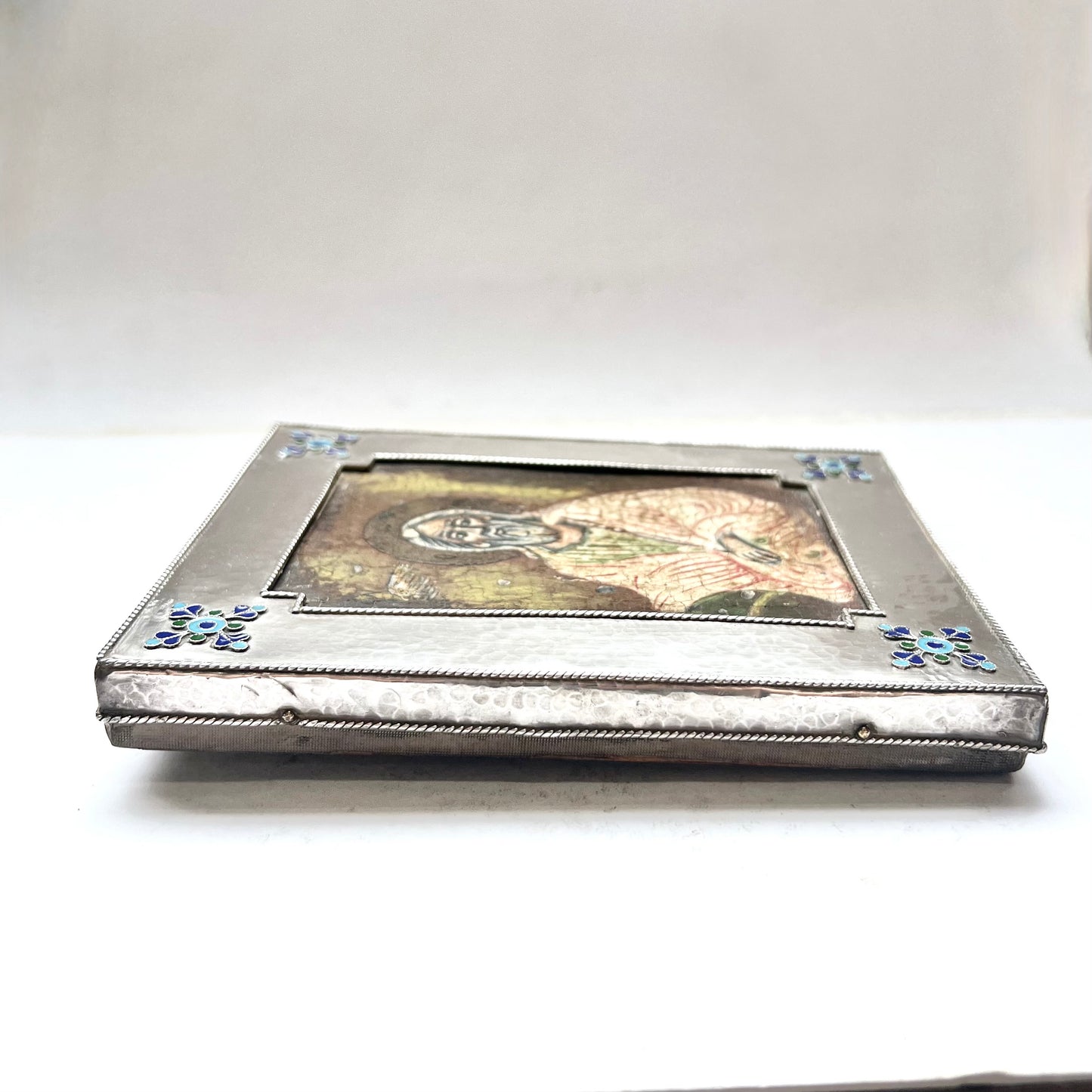 Early 20th century European icon of a finely painted Orthodox saint with hand-hammered .950 silver frame
