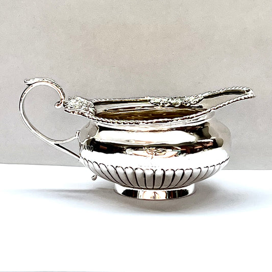 Antique late Victorian crested sterling silver creamer jug, Walter and John Barnard, London, 1888.