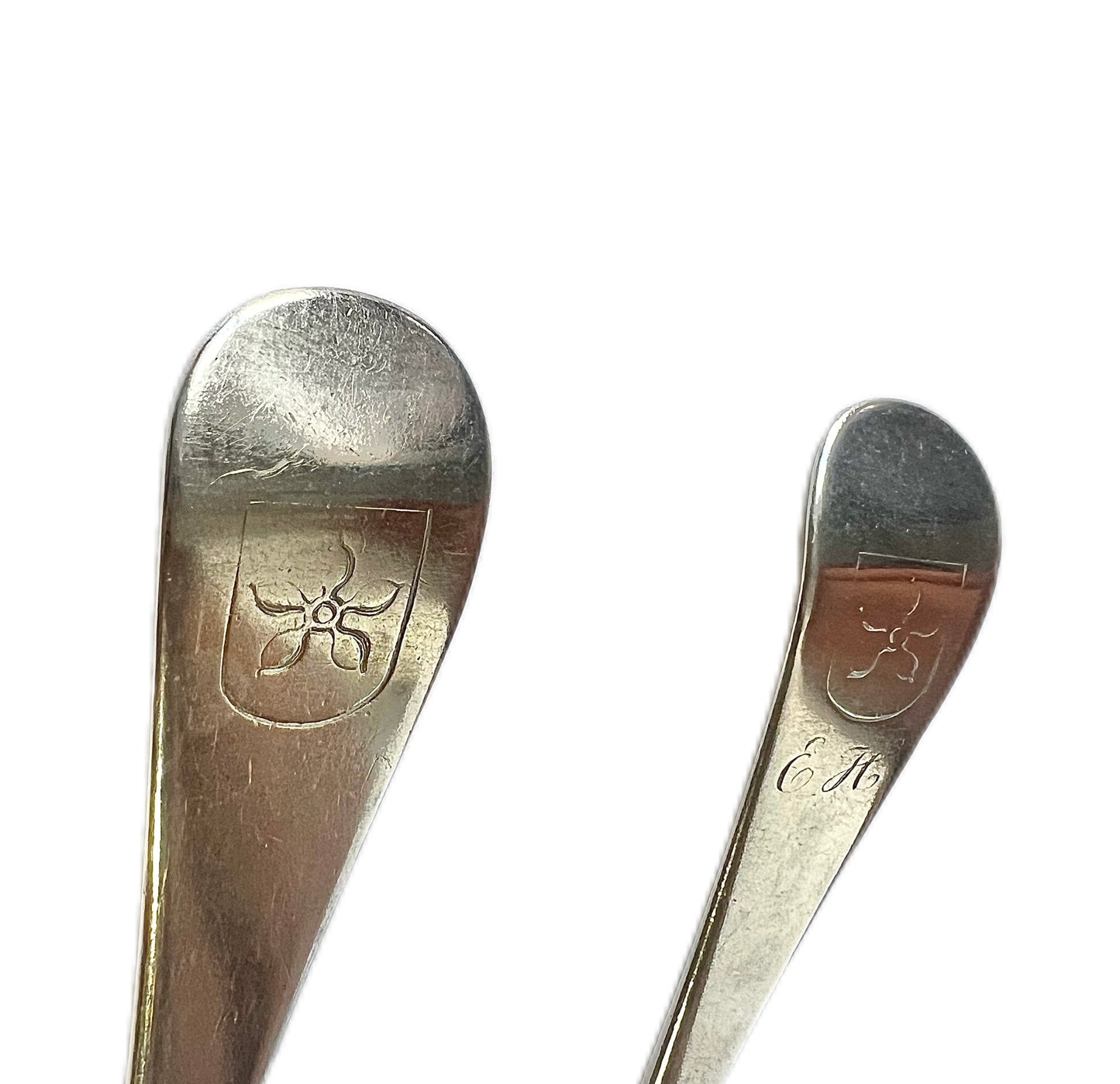 Pair of antique George II crested sterling silver tablespoons