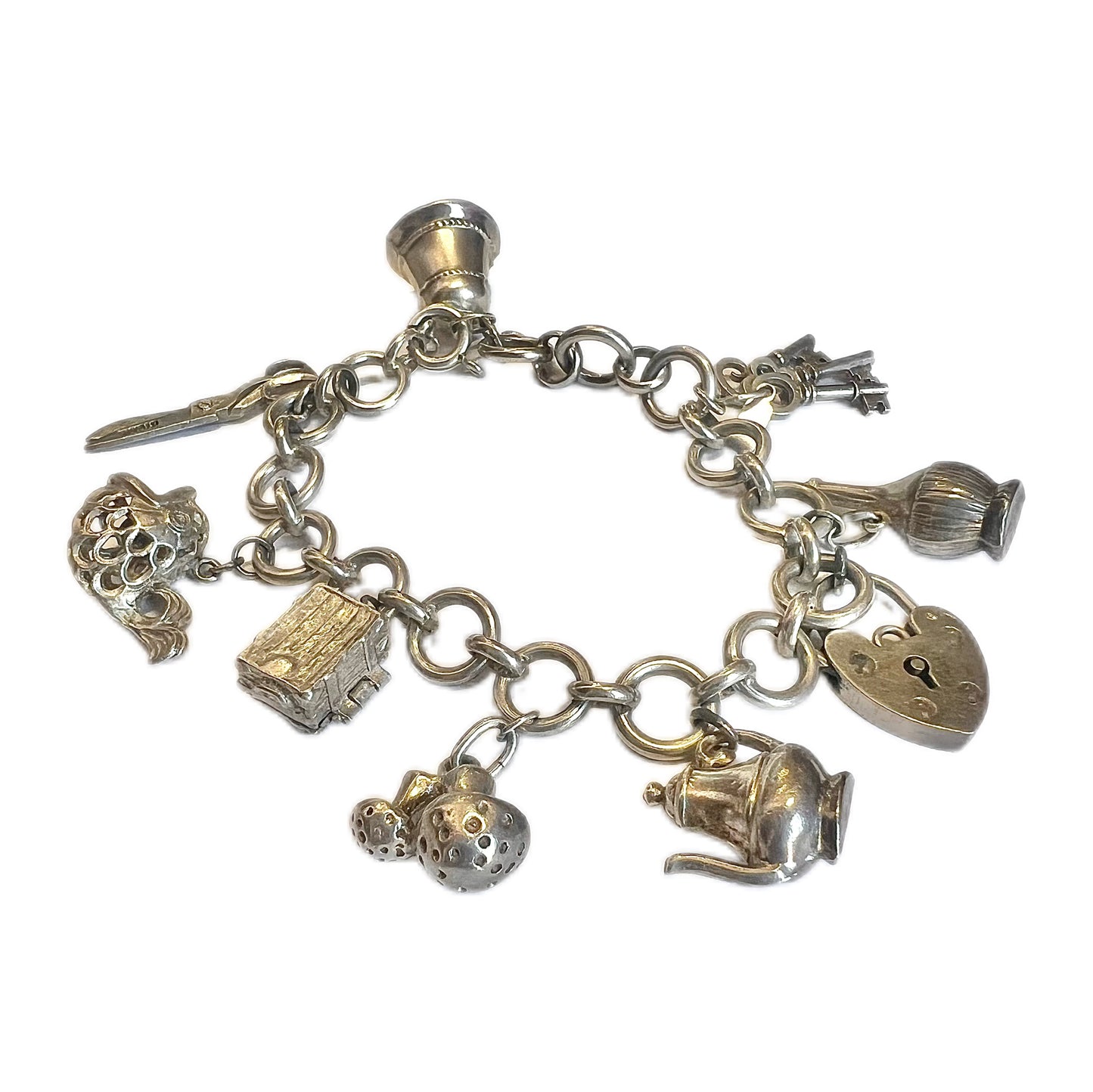 Vintage unmarked silver charm bracelet with 9 charms