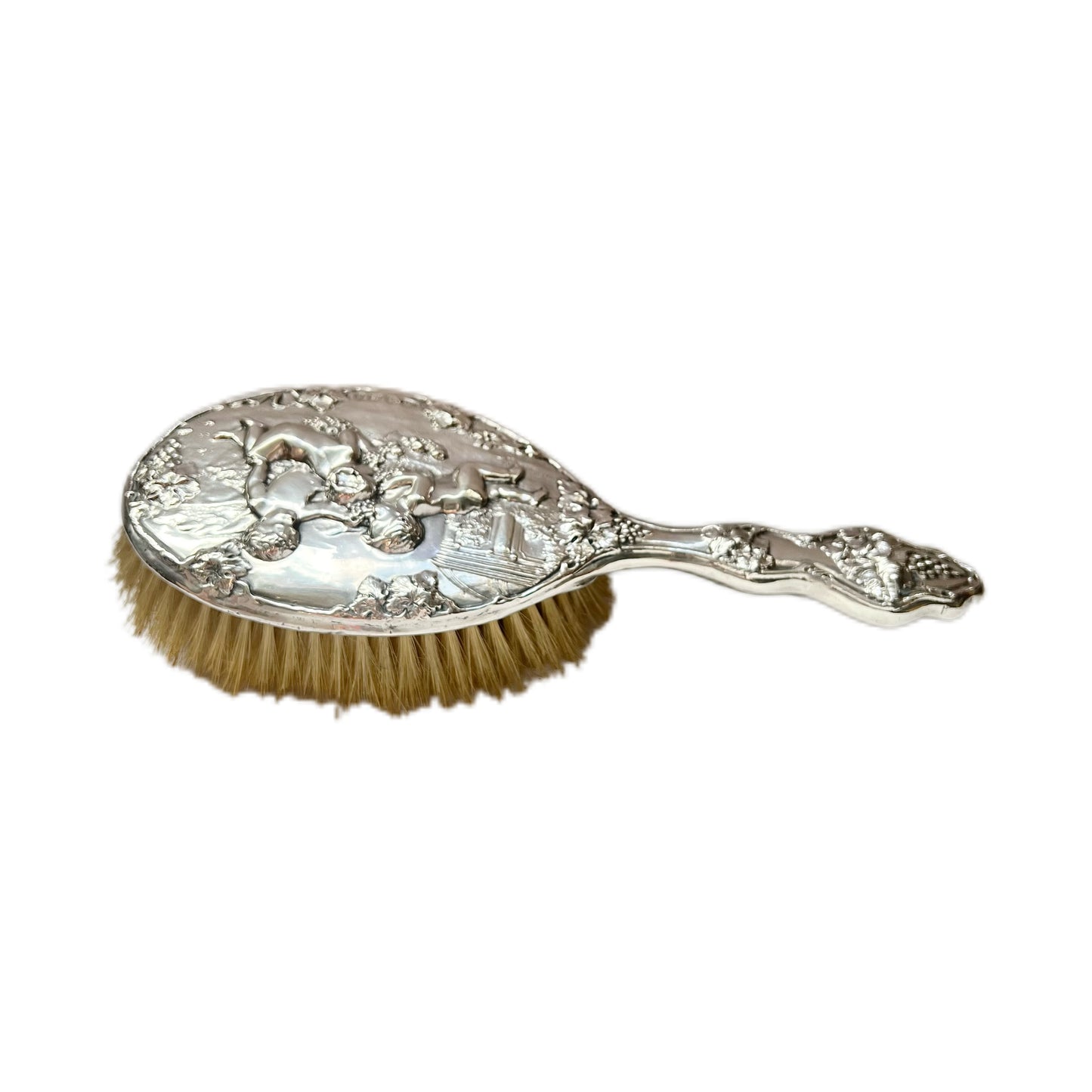 Beautiful antique English sterling silver hair brush with motifs of putti and grapes, William Aitken