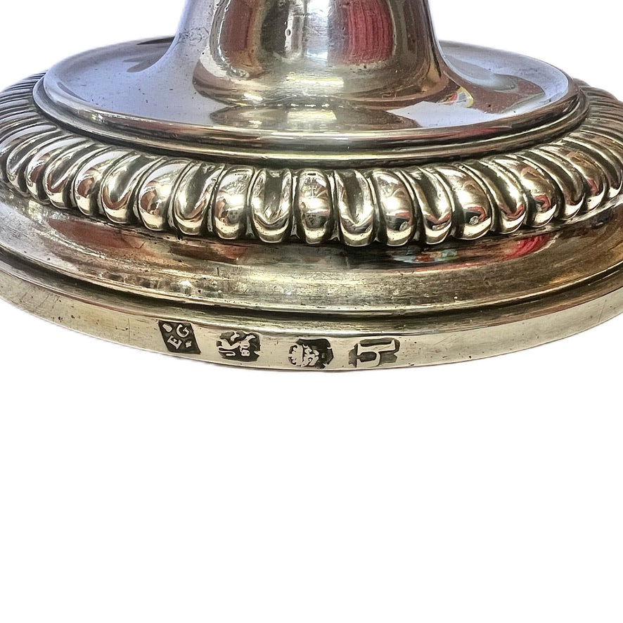Crested pair of George II sterling silver candlesticks by Elizabeth Godfrey