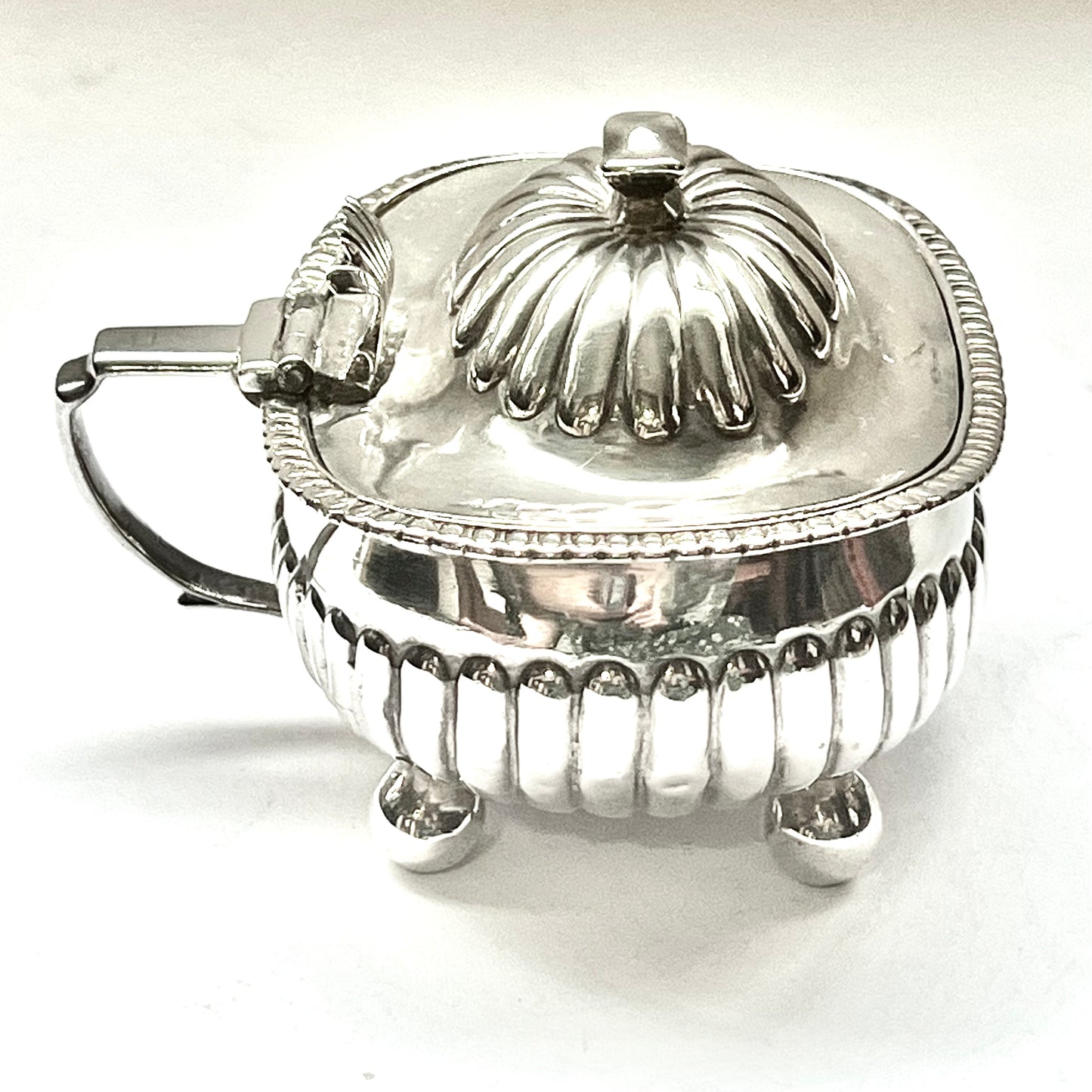 Large George III crested sterling silver mustard pot, with marks for John Lias, 1809, London