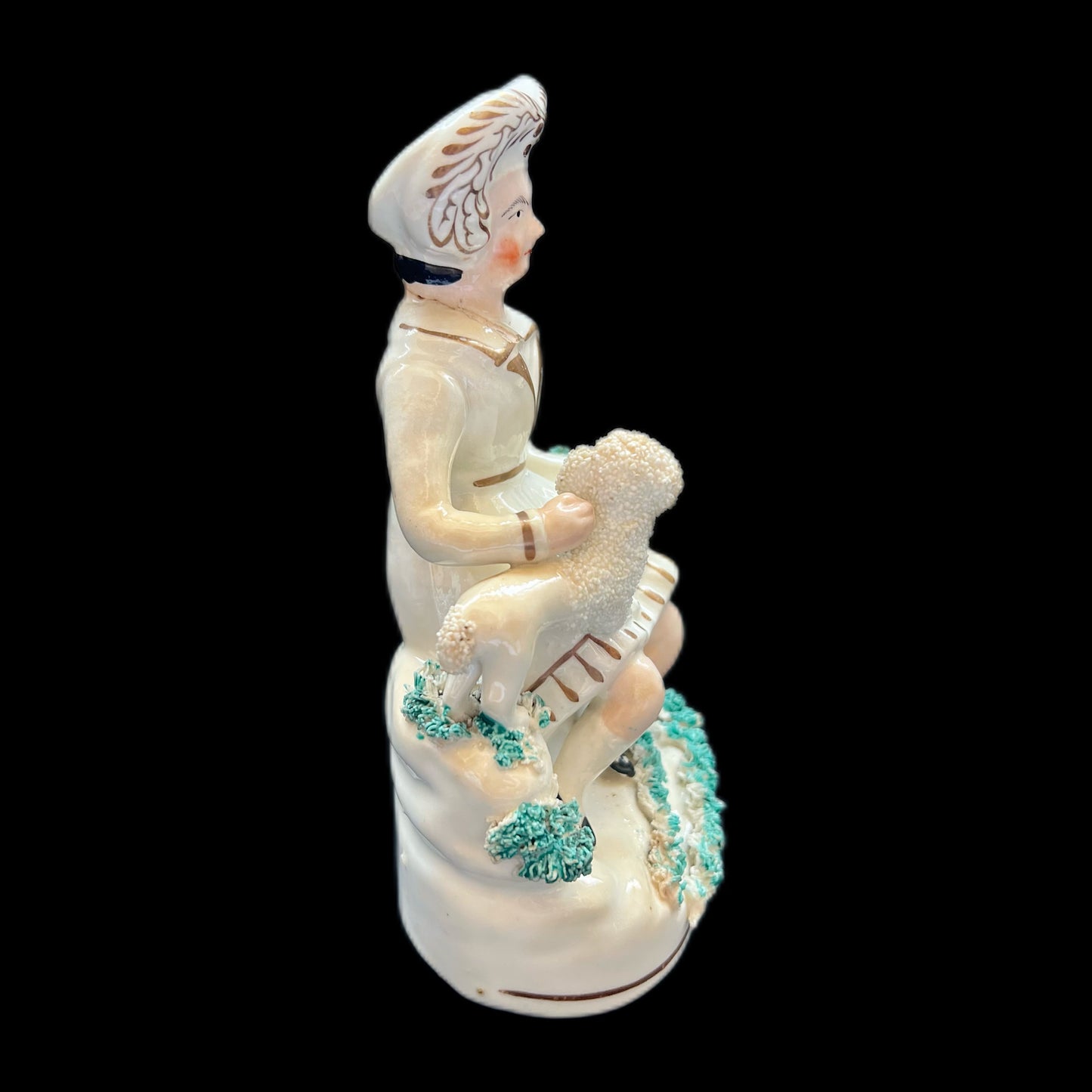 Victorian Staffordshire pottery figurine of a Highland gentleman with his poodle, circa 1840s to 1860s