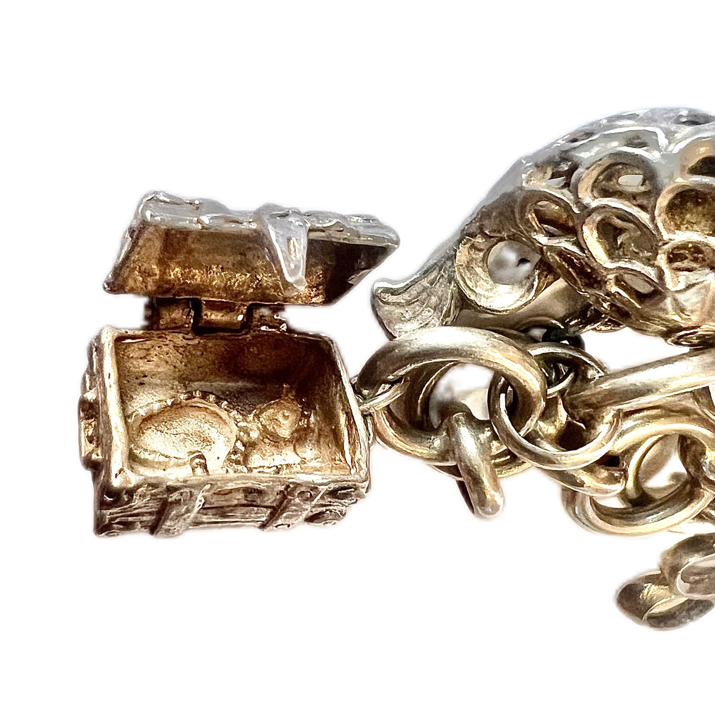 Vintage unmarked silver charm bracelet with 9 charms