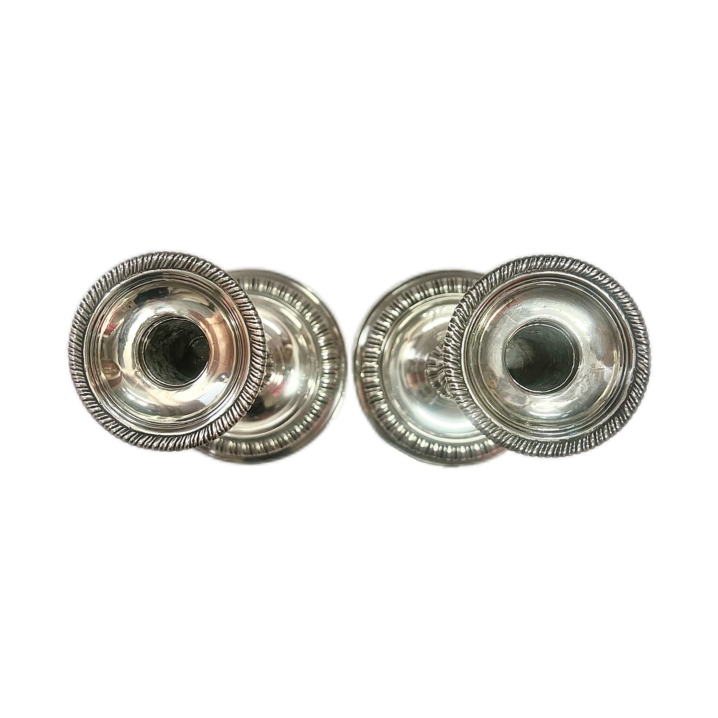 Crested pair of George II sterling silver candlesticks by Elizabeth Godfrey