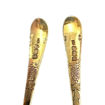 A cased pair of George III antique gilt sterling silver berry spoons, 1782, William Cattel