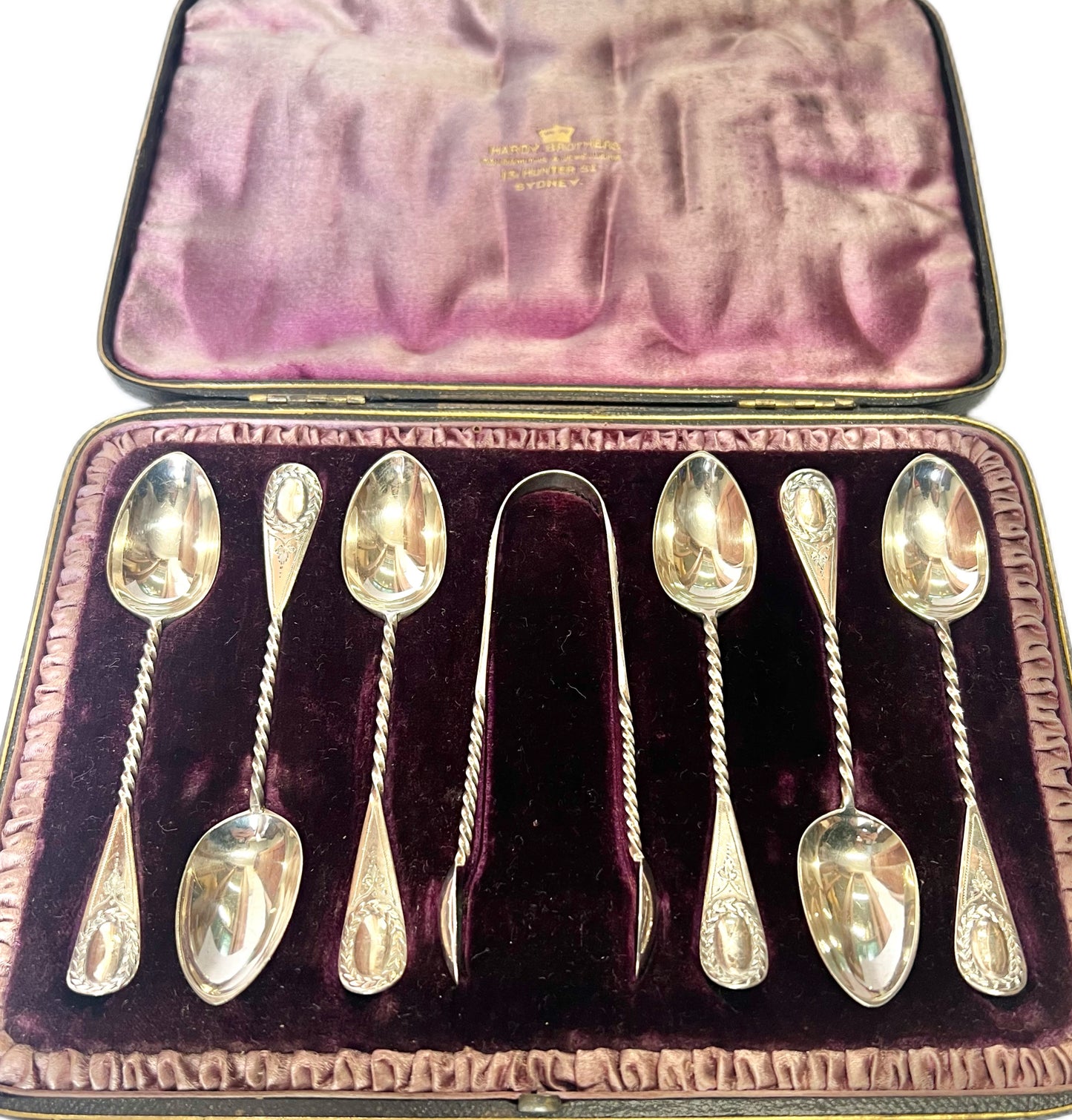 6 antique sterling silver Aldwinckle & Slater teaspoons and a matching pair of sugar tongs, original Hardy Bros box