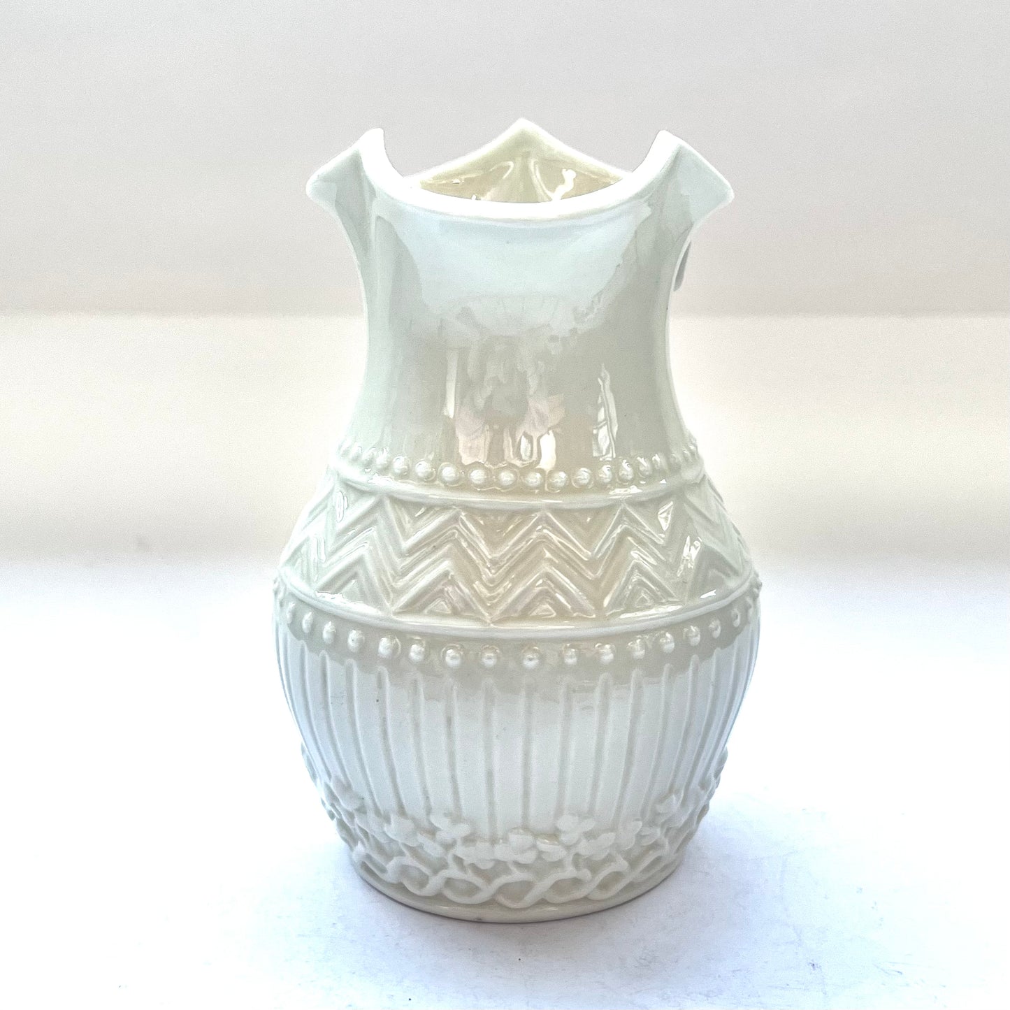 Beautiful small harp-handled milk jug in a rare design by Belleek, Second Black Mark