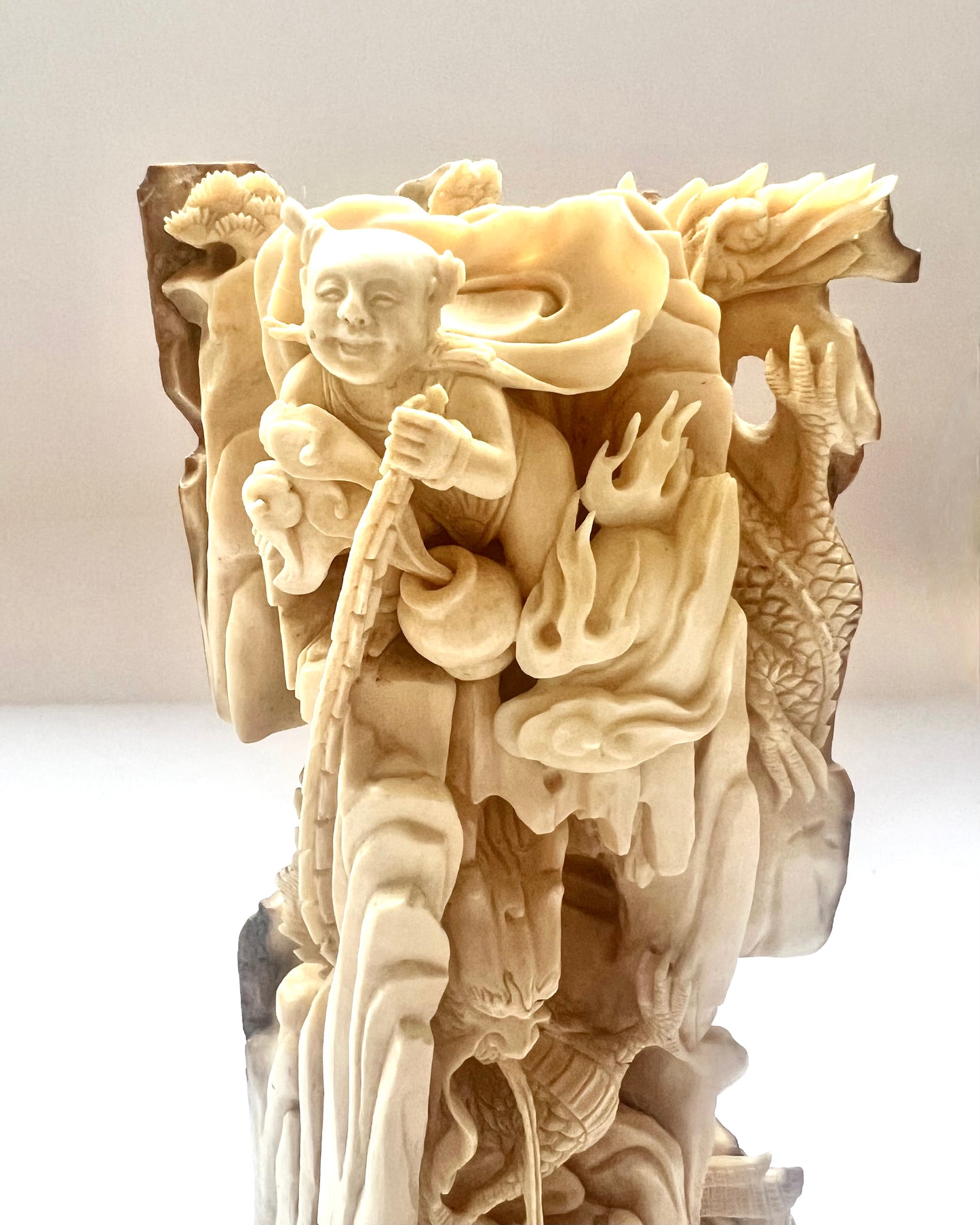 Early to mid 19th century Qing dynasty ivory carving of Nezha subduing Ao Guang, the Dragon King of the East Sea