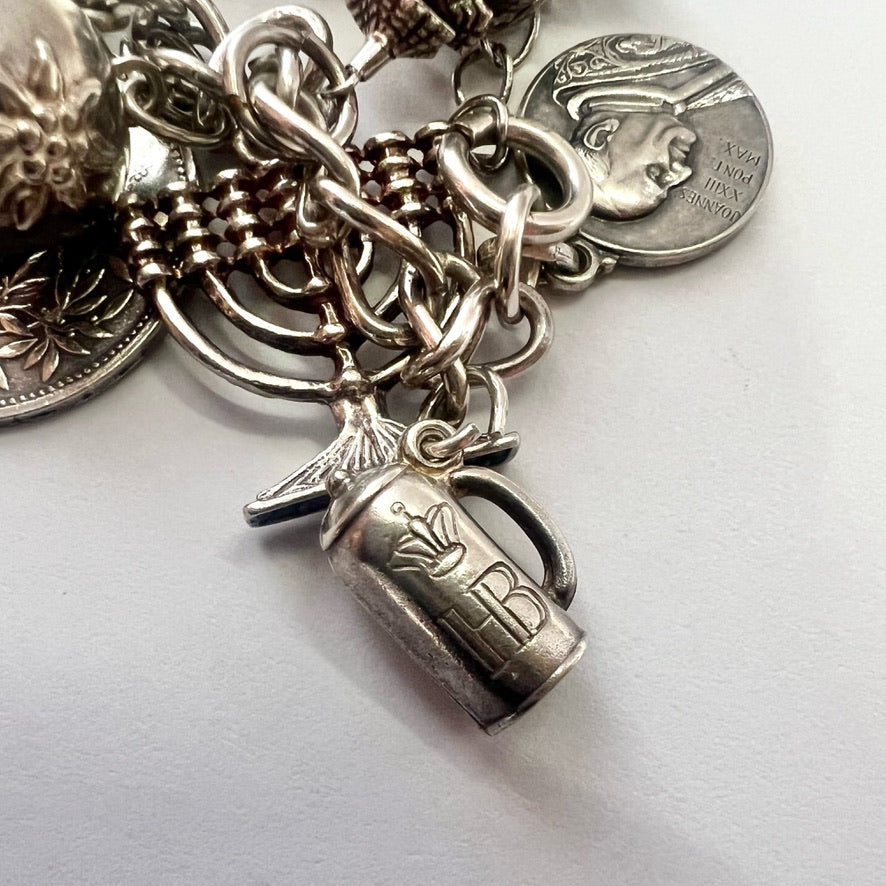 Vintage sterling silver bracelet with 20 attached silver charms