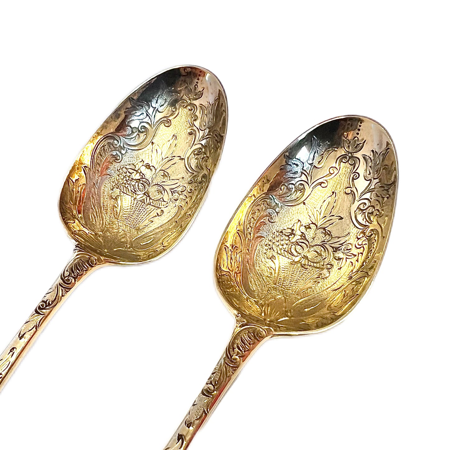 A cased pair of George III antique gilt sterling silver berry spoons, 1782, William Cattel