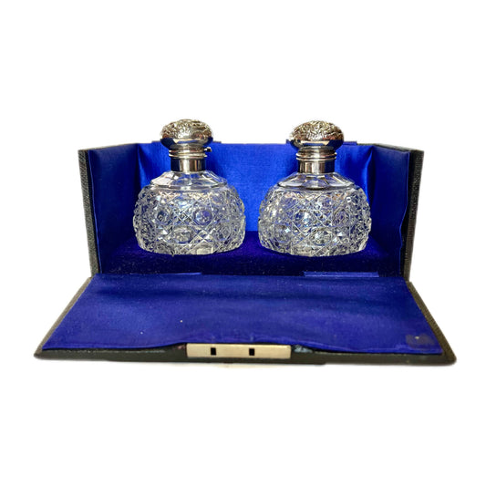 Cased set of two Edwardian sterling sliver and cut glass perfume bottles by G. &; T. Young, NZ