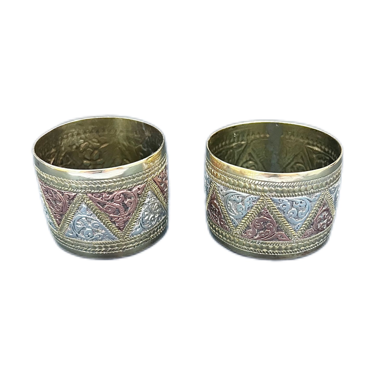 Pair of vintage Indian napkin rings in brass, copper and white metal