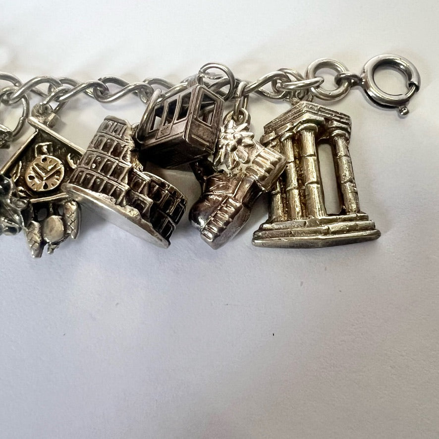 Vintage sterling silver bracelet with 20 attached silver charms