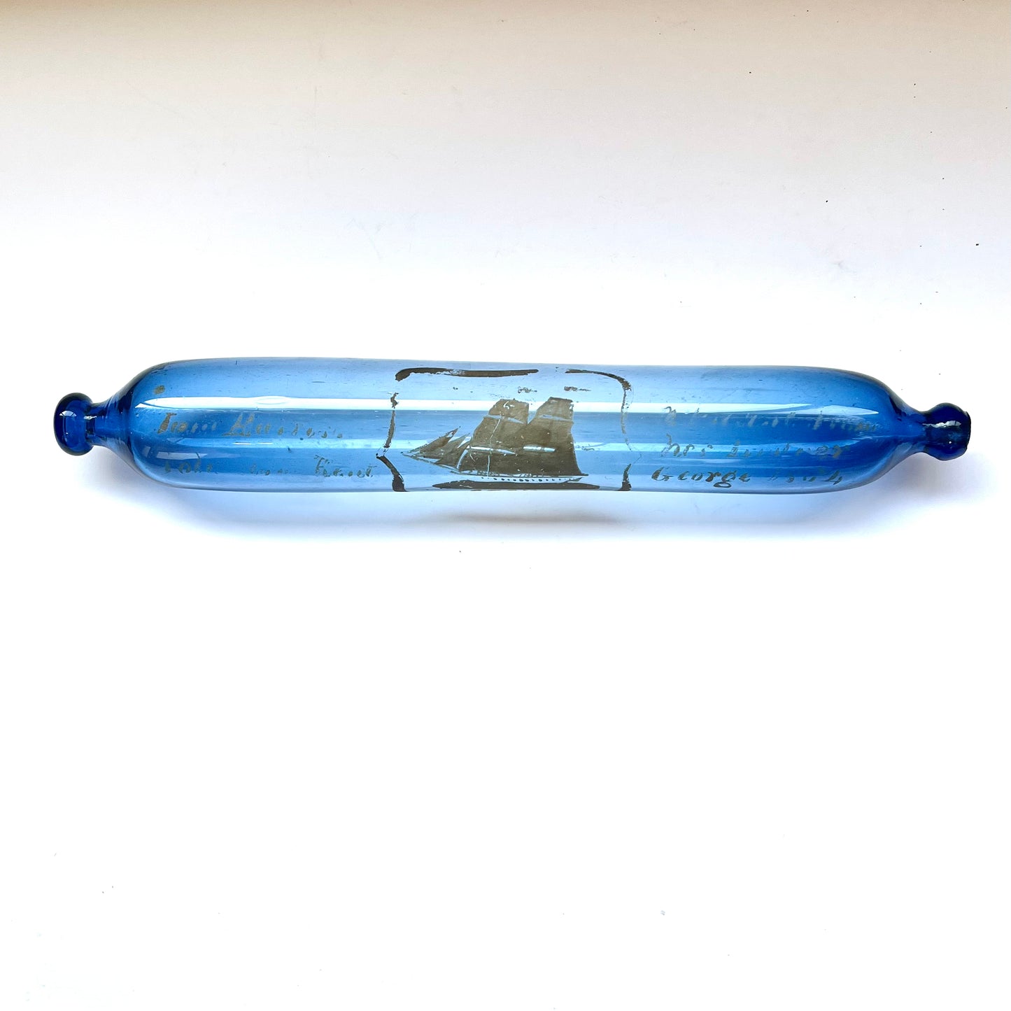 Mid-19th century Bristol glass rolling pin with gilt inscription and sailing ship motif