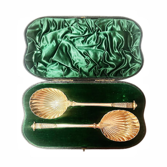 Llate Victorian serving spoons, gilt on sterling silver, Wakely & Wheeler. In original box.