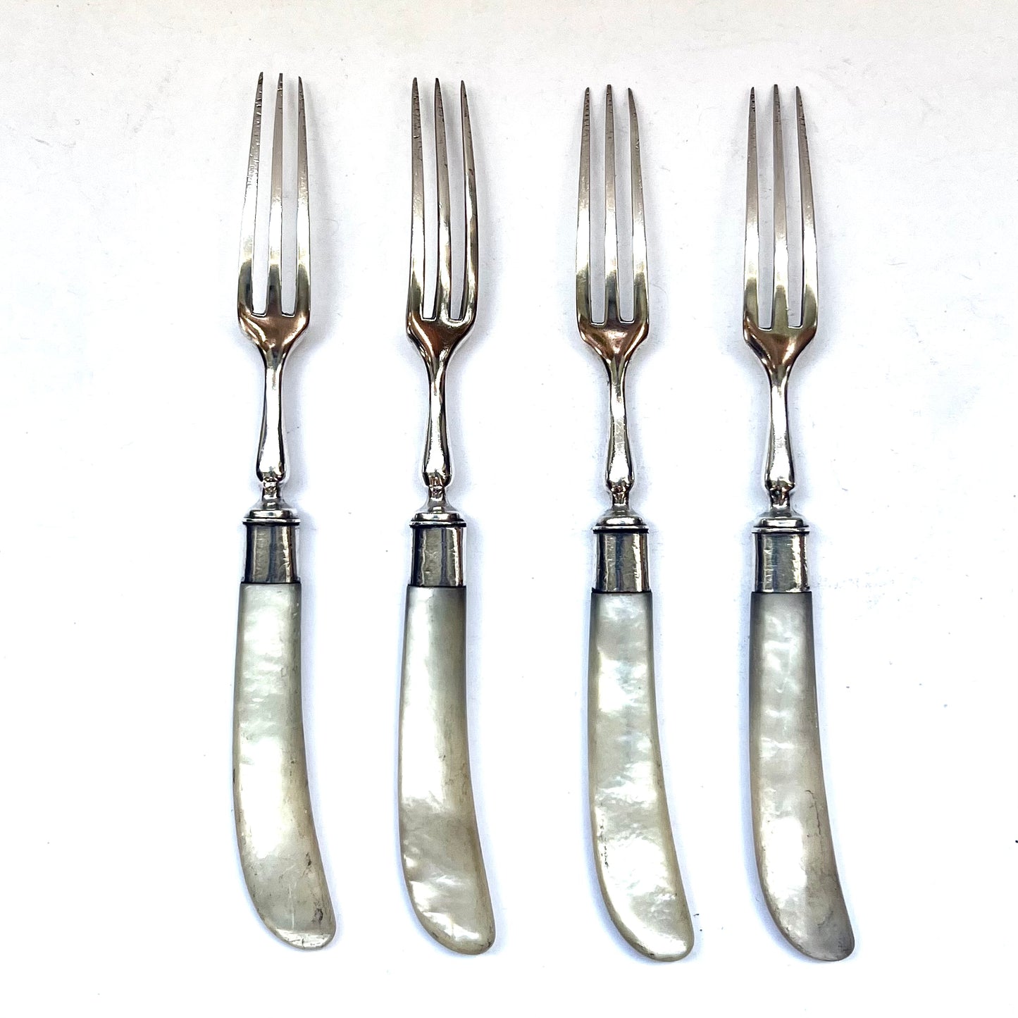 4 sterling silver hors d’oeuvre forks with marks for London, 1899, Holland, Aldwinckle &amp; Slater (Thomas Alfred Slater, Walter Brindsley Slater &amp; Henry Arthur Holland)