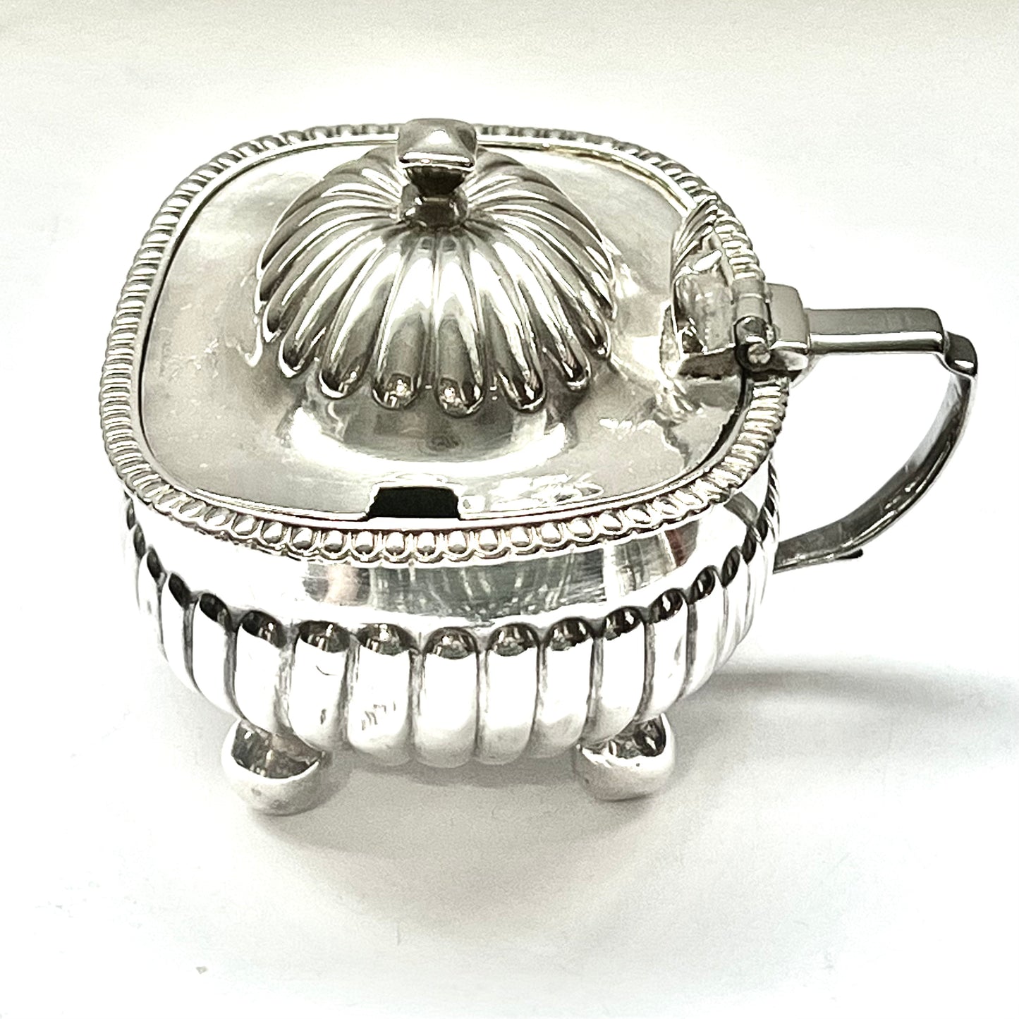 Large George III crested sterling silver mustard pot, with marks for John Lias, 1809, London