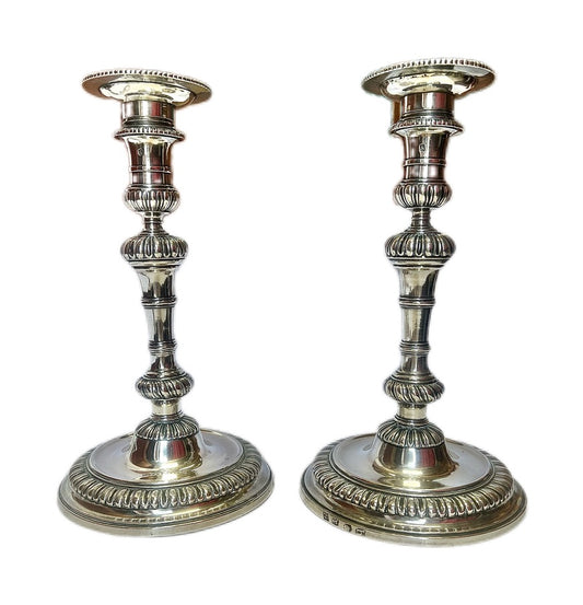 Crested pair of George II sterling silver candlesticks by Elizabeth Godfrey