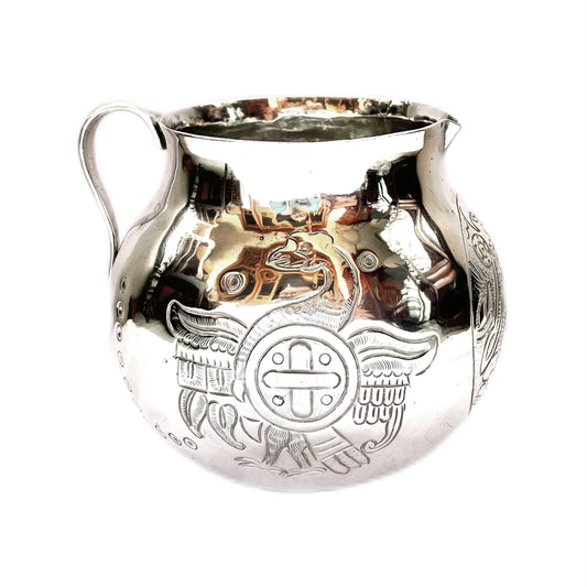 Midcentury Mexican sterling silver pitcher with varying Aztec motifs