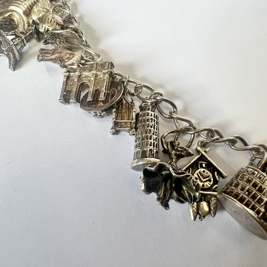 Vintage sterling silver bracelet with 20 attached silver charms
