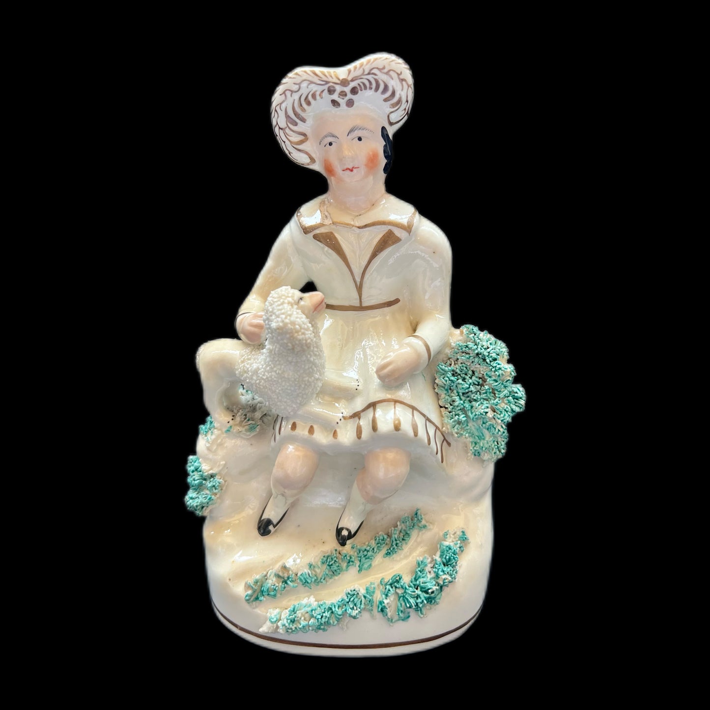 Victorian Staffordshire pottery figurine of a Highland gentleman with his poodle, circa 1840s to 1860s