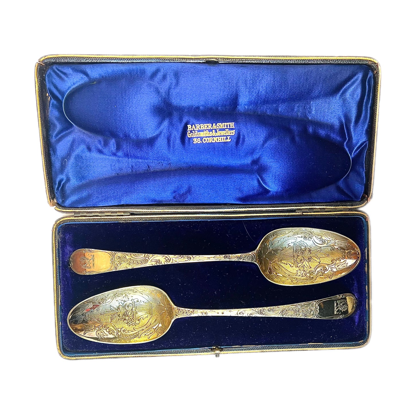 A cased pair of George III antique gilt sterling silver berry spoons, 1782, William Cattel